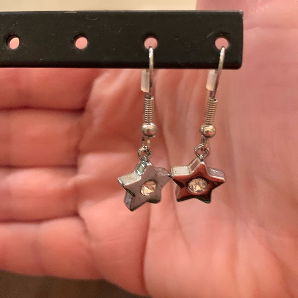 Silver star dangle earrings with rhinestone